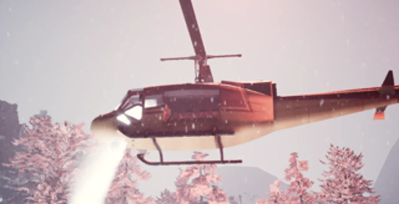 A rescue helicopter over snowy pines