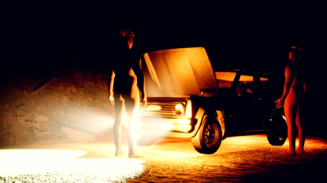 Survivors by a broken-down station wagon at night